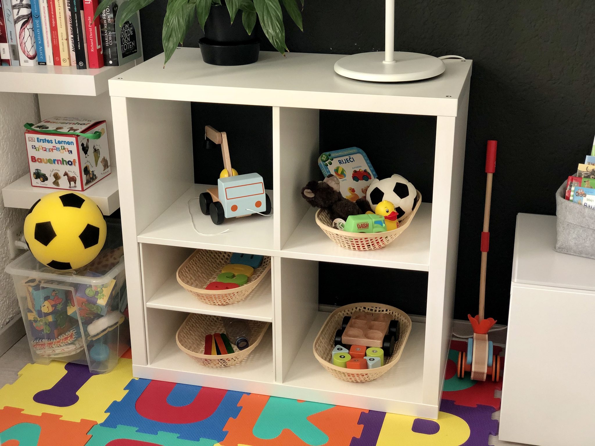Our Montessori shelf at 18 months Happy Mommy Pose